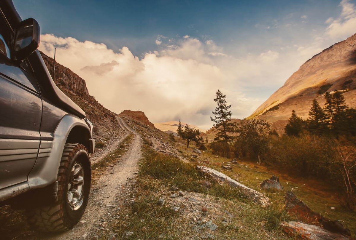 Off-road car on mountain road