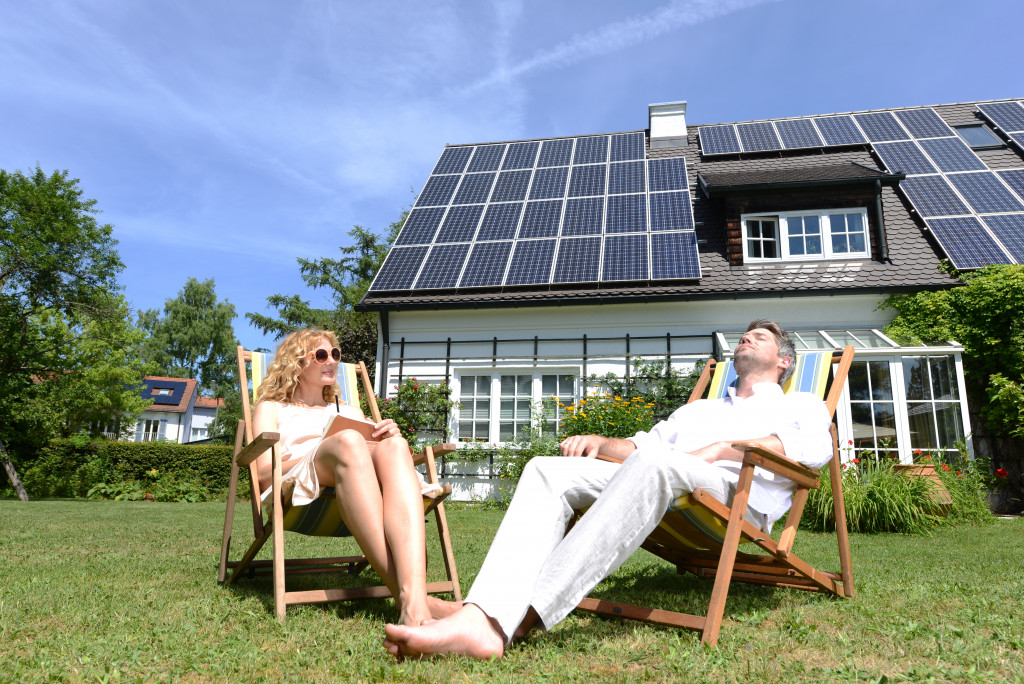 Homeowners using solar panels at home