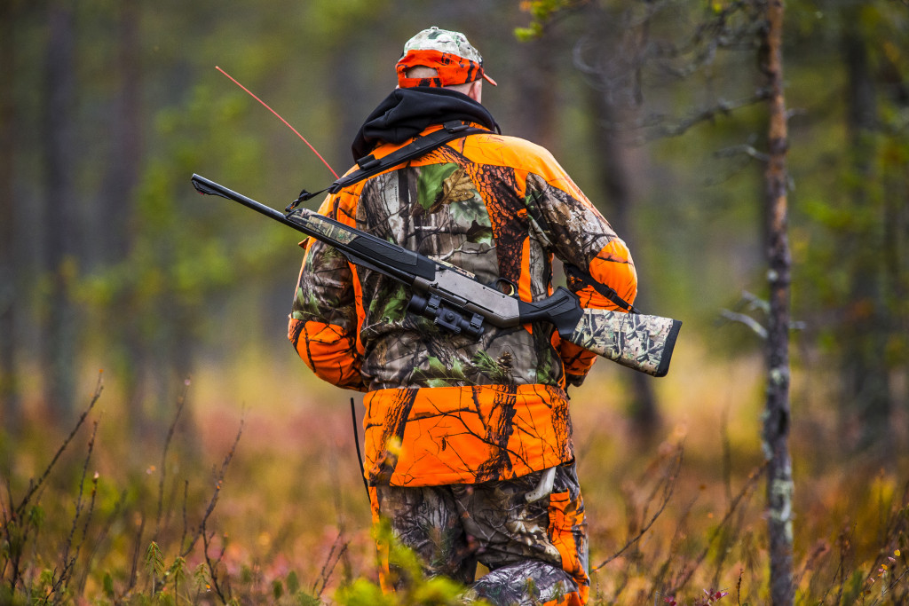 hunter in the fall season with equipment