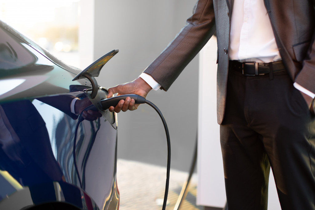 A man charging EV