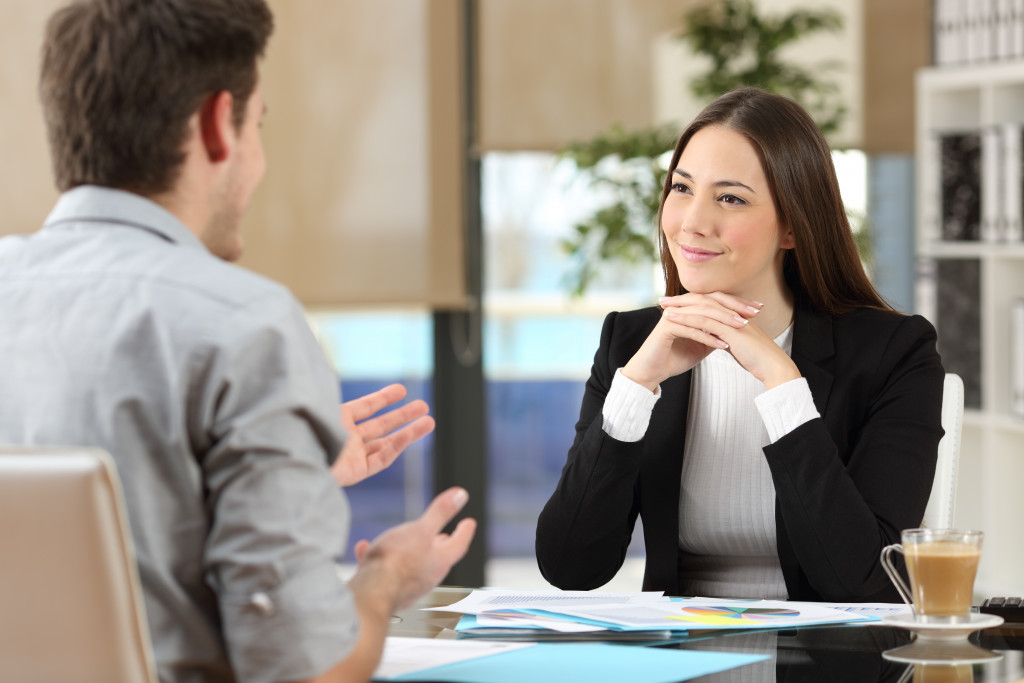 client meeting between man and woman professionals