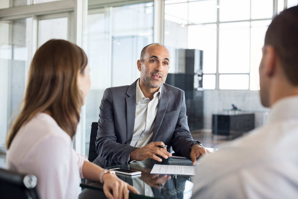 business people talking to an agent