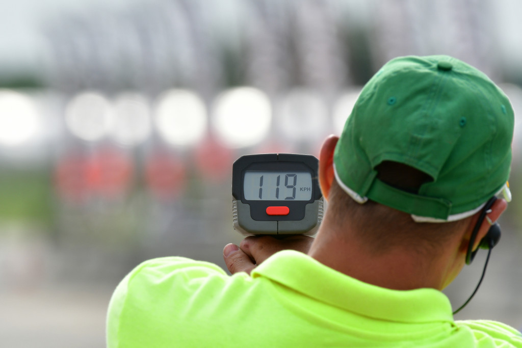 A man using a radar gun for practice